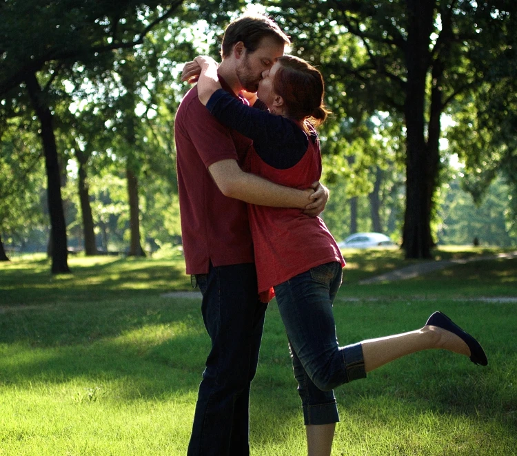 Lisa and David kissing for an engagement photo in Bartlesville, Oklahoma