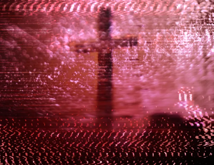 An illustration of a freestanding Christian cross statue